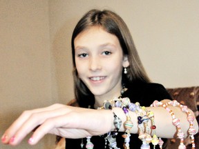 Maya Koomans, 10, of Chatham, made jewelry to help Haitian teen Harry Emmanuel, pay for a surgery on his arm have he couldn't afford. Along with her grandmother, they sold more than $1,600 worth of Haitian-style necklaces and bracelets. (TREVOR TERFLOTH, The Chatham Daily News)