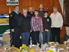OPP FILL-A-CRUISER FILLS PARIS HAMPERS
The Brant County OPP, headed by Ken Johnston, did a Fill-a-Cruiser campaign with proceeds going to the Paris Community Christmas Hamper program at local grocery stores in early December 2012. The OPP delivered an estimated 20,000 pounds in donations of toys and food to the Christmas Hamper Committee members. Committee members, on behalf of the recipients, wish to thank everyone involved for their commitment to the program. SUBMITTED PHOTO