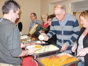 Volunteers were busy serving food at the free Christmas dinner at the Salvation Army Church in Melfort on Christmas day.