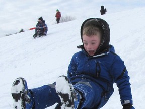Tyler Glavin, 8, of Sarnia gets some air Thursday on his way down the hill at Centennial Park. It was a busy spot for families out enjoying the first big snowfall of the season, Environment Canada estimated that about 20 cm fell in Sarnia. Sarnia, Ont., Dec. 27, 2012 (PAUL MORDEN, The Observer)