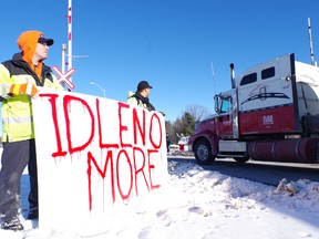 Protesters hold a sign on Highway 17 in Sault Ste. Marie, Ont. on Thursday, Dec. 27, 2012. Members of Garden River and Batchewana First Nations held a highway and rail blockade in support of the Idle No More movement.
MICHAEL PURVIS/SAULT STAR/QMI AGENCY