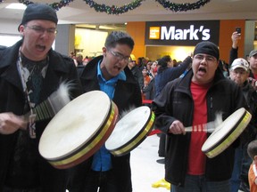 The Idle No More protest movement came to Lambton Mall for Boxing Day. A large group of protesters danced in a circle inside the mall at noon as several others sang and played drums. It followed a rally and march in Sarnia Monday, as well as an ongoing blockade of a CN spur line at Aamjiwnaang First Nation. Sarnia, Ont., Dec. 26, 2012 PAUL MORDEN/THE OBSERVER/QMI AGENCY