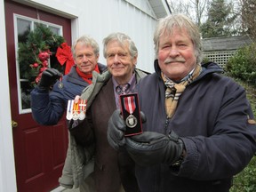 The Bateman brothers have all been recognized for their achievements with Jubilee medals. Former Ontario Fire Marshal Jack Bateman, centre, received the Queen Elizabeth II Silver Jubilee medal in 1977. Brothers Robert, left, and Ross, right, are recent recipients of the Queen Elizabeth II Diamond Jubilee medal. (MONTE SONNENBERG Simcoe Reformer)