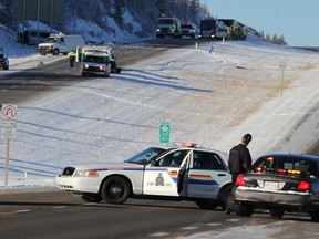 Cochrane RCMP and EMS at the scene of a fatal collision in the eastbound lanes of Highway 1 on Scott Lake Hill on Dec. 27.  One person was dead at the scene.  There were two unrelated collisions in the same area. Cochrane RCMP and emergency crews were left scrambling to deal with many accidents on icy roads in the Cochrane area.