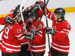 Join our national hockey guys on the ground in Russia following Canada's game against Slovakia on Friday. (REUTERS)