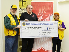 Pictured (left to right) Doug Earle, member of the Lions Club, Ed Giles of the Salvation Army and Mary Heimbecker, member of the Lions Club pose with the $500 cheque.