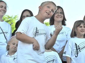 In this QMI Agency file photo, Parker Laanstra does his best air guitar during Harmony's performance at Bayfest 2010. The youth group has reopened its doors since a nine-month hiatus. QMI AGENCY
