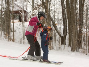 Andrea Brown guides her son Braden, 3 down a run at Boler Mountain. Andrea and her husband London councillor Matt Brown had Braden out skiing last year as well. (MIKE HENSEN/The London Free Press)