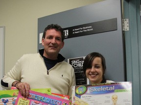 Faculty advisor Jon Milos and president Amanda da Silva, of Students in Free Enterprise (SIFE) Lambton, pictured here at Lambton College in Sarnia, Ont. Thursday, Nov. 6, 2012, show off the teaching aids they've taken to Zambia. The group is embarking on a five-year project to better the lives of villagers in the third world country. BARBARA SIMPSON / THE OBSERVER / QMI AGENCY