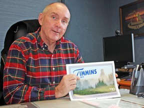 Looking to turn the page on another calendar year, Timmins Mayor Tom Laughren looked ahead to 2013 and talked about the challenges and opportunities he sees in the city's future. Here, he poses with his new Timmins 2013 calendar.