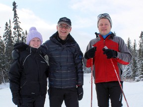 Nature explorers Hillary, left, and Jim Banks pose for a picture with Porcupine Ski Runners (PSR) president and cross-country skier Mike Kornell before heading out on a snowshoe trek through some the 32 kilometres of pristine forest trails behind the PSR chalet.