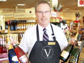 Paul Eaton, product consultant for the LCBO on Brookdale Ave. in Cornwall, showcases some of the popular sparkling wines for the season. 
Staff photo/ERIKA GLASBERG