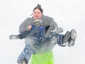 GINO DONATO/Sudbury Star file photo
Johnathan Dee gets some airtime with his aunt Jamie Ness while tobogganing at Bell Park in this file photo from 2012.