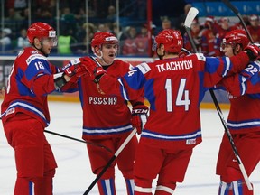 Russia's (L-R) Yaroslav Kosov celebrates his goal with teammates Nikita Nesterov, Vladimir Tkachyov, and Andrei Mironov against Germany at the World Junior Hockey Championship in Ufa, December 29, 2012.    REUTERS/Mark Blinch