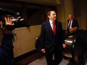 National Hockey League Commissioner Gary Bettman and Maple Leaf Sports & Entertainment Chair Larry Tanenbaum (R), return to league negotiations in New York December 4, 2012. (Reuters/ERIC THAYER)