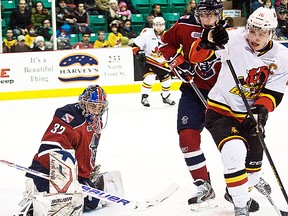 Belleville Bulls captain Brendan Gaunce is held in check while Kitchener Rangers goalie Franky Palazzese makes a save during OHL action Saturday night at Yardmen Arena. (Don Carr for The Intelligencer.)