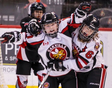 Oakville Hornets Madison Cote is congratulated on her goal by teammate Amelia Smith during the Bell Capital Cup Girls Atom AA Championship at Scotiabank Place against the Nepean Wildcats on Sunday December 30,2012. Errol McGihon/Ottawa Sun/QMI Agency