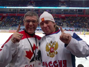 St. Albert Mayor Nolan Crouse takes a photo with a Russian fan inside Ufa Arena in Russia during the 2013 International Ice Hockey Federation Junior World Championship. SUPPLIED