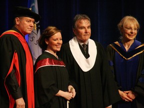 Kevin Nagel, president and CEO of Keyano College, with help from John Wilson, Keyano College Board of Governors, and Marsha Kuchelema, registrar, presented parchments to the 150 or so graduates that attended the 46th annual Keyano College Convocation ceremony in 2012. TODAY FILE PHOTO