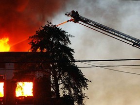 The Timmins Fire Department uses an aerial attack to battle an early morning blaze at the offices of District School Board Ontario North East (DSBONE) in July. The building was destroyed.
