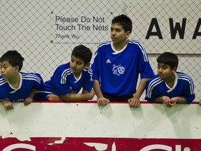Ellerslie Eagles U12 Boys players watch soccer play during their match against the Spruce Grove Chrome at the 2012 FC Edmonton Polar Cup 2012 at Edmonton Soccer Centre South in Edmonton, Alta., on Sunday, Dec. 30, 2012. The event, one of the largest in Canada, saw hundreds of players take part across the city. Ian Kucerak/Edmonton Sun/QMI Agency