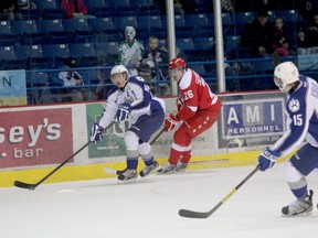 Sudbury Wolves defenceman Charlie Dodero looks for a teammate to pass to with Sault Ste. Marie Greyhounds' Michael Shumacher keeping an eye on him during OHL action at Sudbury Community Arena on Sunday afternoon.