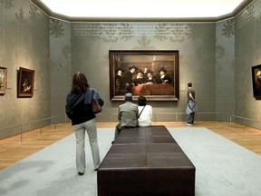 People look at old master paintings in a temporary gallery at Amsterdam's acclaimed Rijkmuseum. After a 10-year closure for major renovations, the museum will reopen in April. (Handout)