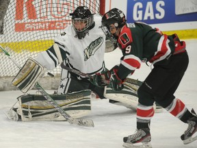 South Side Athletic Club forward Giorgio Estephan takes a shot on Calgary Northstars goalie Derek Mazil during a Mac’s tournament game at Max Bell Arena in Calgary on Boxing Day.