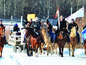Blake Wildcat-Buffalo, who organized the event, leads a contingent of supporters, including several on horseback, during the Horse Nation Idle No More rally held Dec. 29 in Hobbema, 15 kilometres south of Wetaskiwin. The rally was held in support of native rights and Attawapiskat Chief Theresa Spence, who is now in her third week of a hunger strike in an effort to meet with Prime Minister Stephen Harper.