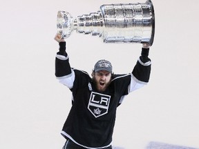 Kenora’s Mike Richards lifts the Stanley Cup after the Los Angeles Kings defeated the New Jersey Devils 4-2 in the best-of-seven championship series in June.
FILE PHOTO/QMI Agency