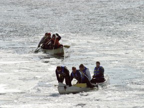 The Polar Paddlers, with the Flying Trappers in close pursuit, emerge from icy waters at a canoe race during the annual Winter Carnival which ran March 2-4.
FILE PHOTO/Daily Miner and News
