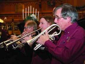 Brockville Concert Band trumpeters Malcolm Robinson, Sarah Pattingale-Jones and Alan Bennett perform at Wall Street United Church.