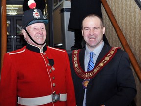 Mayor Dave Henderson, right, used the occasion of the annual New Year's Day Levee at city hall on Tuesday to forecast that 2013 will be a year of bold discussions and tough decisions on the path Brockville must take into the future. (ALANAH DUFFY/The Recorder and Times)