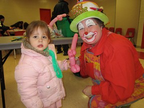 Chloe the Clown (a.k.a. Kay Holmes of Simcoe) twisted up some amazing balloon animals during Norfolk County’s New Year’s Eve party at Talbot Gardens Monday night. Taking possession of this pink puppy was Hailey Smelser of Simcoe. (MONTE SONNENBERG Simcoe Reformer)