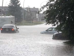 Flooding in the streets of Lacombe. (Globe file)
