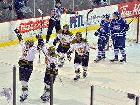 Brampton Battalion rookie Blake Clarke, left, celebrates his second goal of the game in front of teammates Patrik Machac, Brendan Childerley and Marcus McIvor during the team's 5-2 win over the Mississauga Steelheads at the Powerade Centre, Monday.Photo courtesy of Doug Ball/Brampton Battalion
