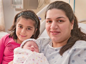 BRIAN THOMPSON, The Expositor

Samana Zaki of Brantford holds her newborn daughter, Masoom, a little sister for six-year-old Leeba (left) on Tuesday at Brantford General Hospital. The baby was born at 9:20 a.m., weighing six pounds, eight ounces.
