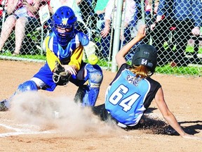 Wetaskiwin Wild catcher Hannah MacDonald attempts to make a tag, but it was a little too late as Rylee Cassidy of Red Deer crosses the plate. The teams would meet again in the gold medal game of the U12 girls softball provincials held in Wetaskiwin in July.