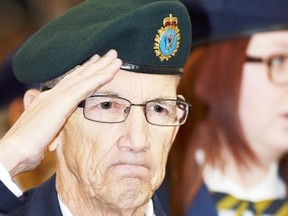 Wetaskiwin’s own Terry Hurd salutes during the playing of O Canada during the Remembrance Day ceremony at the Drill Hall in Wetaskiwin.