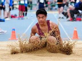 Wetaskawin Composite High School long jumper Elijah Aportadera land shard in the sand during the intermediate boys long jump finals at the 2012 ASAA Track and Field Championships at Foote Field last weekend. TREVOR ROBB/ EDMOTNON EXAMINER