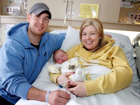 Belleville, Ont. residents and new parents Aimee and Brian Golden hold their son Liam, who was born at 7:34 p.m. at Belleville General Hospital on New Year's Day, Tuesday, Jan. 1, 2013. JEROME LESSARD/The Intelligencer/QMI Agency