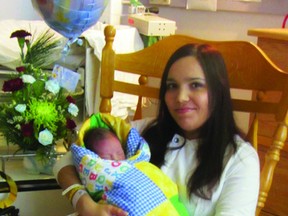 New mom Kamilla Paige Garrioch holds the first baby born in Portage la Prairie in 2013. Her son, Kiptyn Kaylor Garrioch, was born at 7:53 a.m. on Jan. 2 at the Portage and District Hospital. (ROBIN DUDGEON/PORTAGE DAILY GRAPHIC/QMI AGENCY)