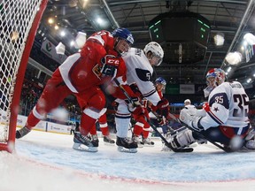 Team USA's goalie John Gibson (R) defends the net with Connor Murphy (C) against Czech Republic's Jan Stencel during the third period of their quarter-final game at the 2013 IIHF U20 World Junior Hockey Championship in Ufa, January 2, 2013.  (REUTERS)