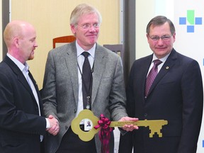 Alberta Infrastructure Minister Jeff Johnson (left) hands Alberta Health Services CEO Chris Eagle a symbolic key to the new Fort Saskatchewan Community Hospital, as former Fort Saskatchewan-Vegreville MLA Ed Stelmach looks on. The hospital was opened in March 2012.
Fort Record File Photo