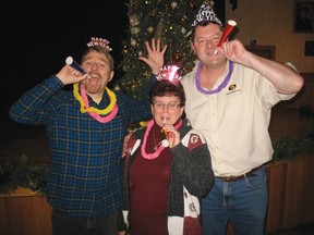The Delhi Belgian Club was a rocking place to be on New Year’s Eve as they hosted a bash with the country-rock band, Dry County. Showing off some New Year’s hats and noisemakers in preparation for the party are, from left to right  Bill Peat, Linda Scott and Randy Casiers. (SARAH DOKTOR Delhi News-Record)