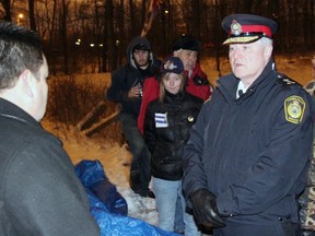 Aamjiwnaang First Nation Chief Chris Plain, left, converses with Sarnia Police Chief Phil Nelson prior to a celebratory ceremony at the CN rail blockade on Williams Dr. (PAUL OWEN, The Observer)