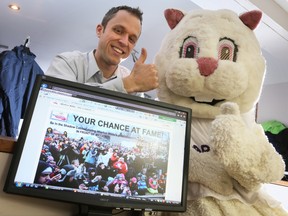 Leigh Grigg of the Wiarton Willie Festival and the Wiarton Willie mascot give a thumbs up in this 2013 file photo.