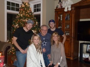 Jarrett Burton (back row, far right) enjoys some family time with his brother, Tanner (left), dad, Tim, mom Cathy (right) and sister Kelsey (left).