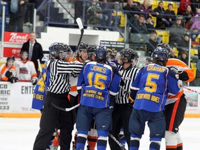 The Fort McMurray Oil Barons exchange words after the second period during Wednesday’s game against the Drumheller Dragons. Officiating stole the show in the second period as Drumheller was awarded a goal that never crossed the line and multiple players were handed misconduct penalties. TREVOR HOWLETT/TODAY STAFF