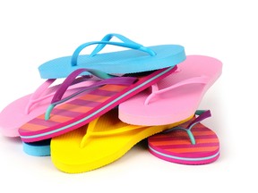 Wear flip-flops in shower areas. The heat and moisture from showers and saunas create the perfect breeding ground for fungal infections and bacteria. (Fotolia)